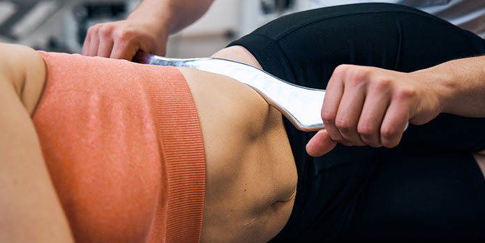 patient getting graston chiropractic as an auto accident injury treatment in Pompano Beach