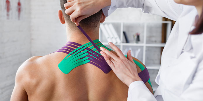 patient getting kinesio tape as an auto accident injury treatment in Pompano Beach
